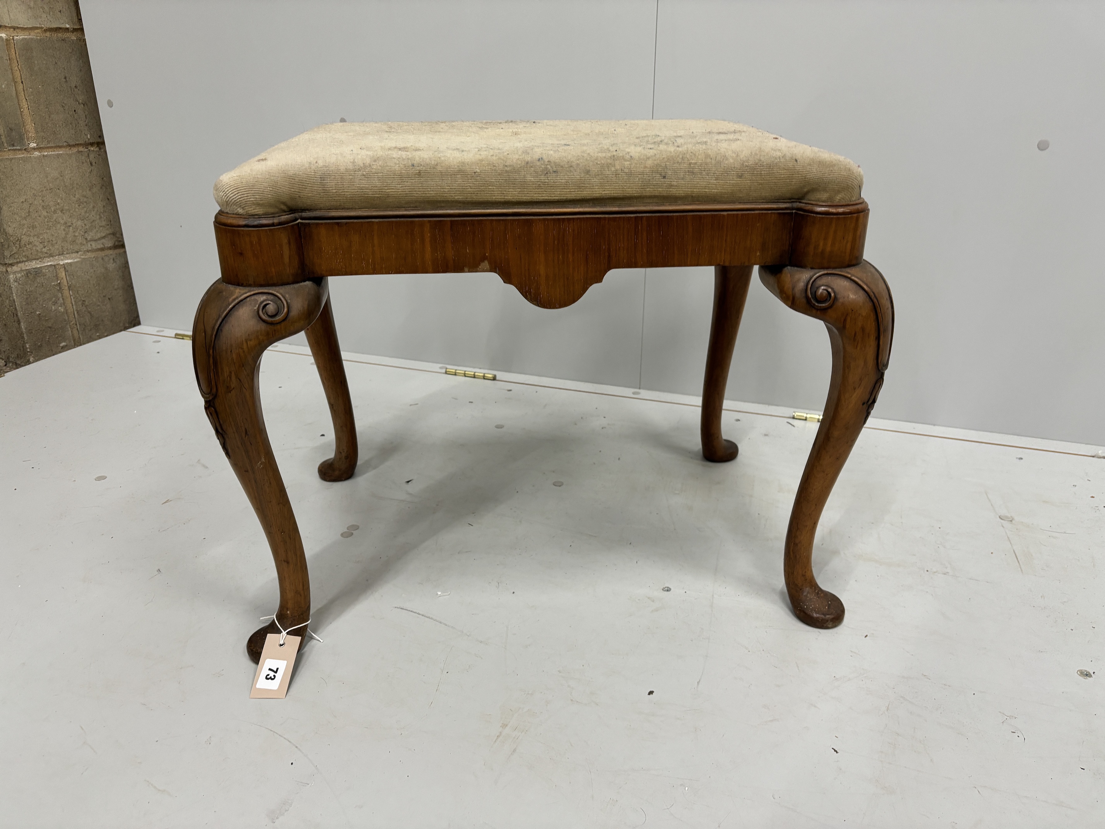 A Queen Anne Revival walnut dressing stool, width 64cm, depth 48cm, height 51cm